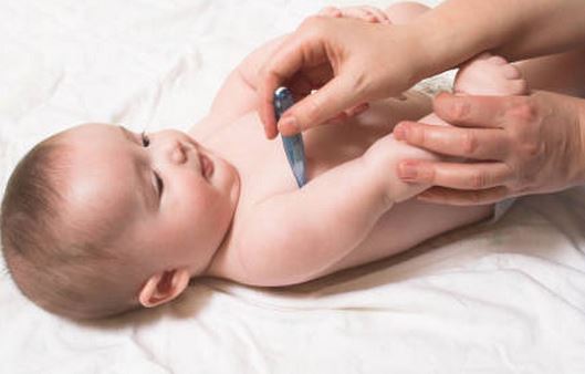 How do you take a child's temperature under the arm?