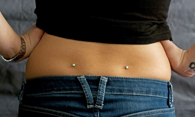 Microdermal surface back dimple piercings